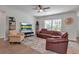 Spacious living room with natural light and a sliding glass door that leads to the outdoors at 2877 Sultan Ct, North Port, FL 34286