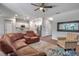 Open-concept living room featuring hardwood floors and a spacious kitchen with stainless steel appliances at 2877 Sultan Ct, North Port, FL 34286