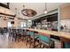 Features a sleek bar with comfortable seating, perfect for enjoying drinks and socializing at 324 Whispering Palms Ln, Bradenton, FL 34212