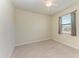 Bedroom with neutral walls, carpet, a window and ceiling fan at 324 Whispering Palms Ln, Bradenton, FL 34212