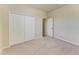 Bedroom featuring a closet and an open door at 324 Whispering Palms Ln, Bradenton, FL 34212