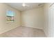 Neutral bedroom featuring a ceiling fan, window and carpeting at 324 Whispering Palms Ln, Bradenton, FL 34212