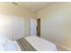 Bedroom with a large closet and an open door at 324 Whispering Palms Ln, Bradenton, FL 34212