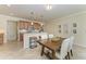 Bright dining area features a breakfast bar with seating and overlooks the kitchen at 324 Whispering Palms Ln, Bradenton, FL 34212