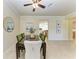 Elegant dining area featuring a stylish table with green chairs and a decorative mirror at 324 Whispering Palms Ln, Bradenton, FL 34212