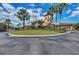 Exterior shot of the clubhouse showing the landscaping and tower at 324 Whispering Palms Ln, Bradenton, FL 34212