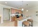 Kitchen bar with granite countertops, stainless steel appliances, and counter seating at 324 Whispering Palms Ln, Bradenton, FL 34212