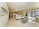 Spacious living room seamlessly connecting to the kitchen and lanai at 324 Whispering Palms Ln, Bradenton, FL 34212