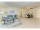 Open-concept living and dining area with stylish furnishings and bright, airy atmosphere at 324 Whispering Palms Ln, Bradenton, FL 34212