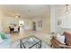 Bright and airy living room flowing into the dining area, with modern decor and plenty of space at 324 Whispering Palms Ln, Bradenton, FL 34212