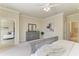 Relaxing main bedroom with a dresser, ceiling fan, and ample space at 324 Whispering Palms Ln, Bradenton, FL 34212