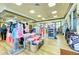 Upscale pro shop featuring golf apparel, accessories, and equipment displayed on stylish fixtures at 324 Whispering Palms Ln, Bradenton, FL 34212