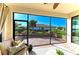 The lanai features comfortable seating and offers views of the lush landscaping and neighboring property at 324 Whispering Palms Ln, Bradenton, FL 34212