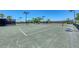 Outdoor tennis courts surrounded by black metal fencing offer a recreational space for residents at 324 Whispering Palms Ln, Bradenton, FL 34212