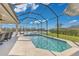 Sparkling blue pool area under a screened enclosure, offering privacy and a serene setting at 3831 Creekside Park Dr, Parrish, FL 34219