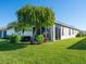 A well-maintained lawn and mature trees surround the patio, offering a private outdoor space at 4155 Cascade Falls Dr, Sarasota, FL 34243