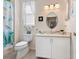 Cozy bathroom featuring a single vanity, decorative shower curtain, and updated fixtures at 4155 Cascade Falls Dr, Sarasota, FL 34243
