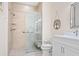 Modern bathroom features a glass-enclosed shower, neutral tile, and vanity with ample storage at 4155 Cascade Falls Dr, Sarasota, FL 34243