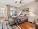 Cozy bedroom with hardwood floors, slider to patio, neutral colors and a comfortable king-size bed at 4155 Cascade Falls Dr, Sarasota, FL 34243