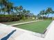 Well-maintained bocce ball court with lush landscaping at 4155 Cascade Falls Dr, Sarasota, FL 34243