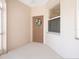 Inviting front entry features neutral tones, a decorative wreath, and a well-lit, covered entryway at 4155 Cascade Falls Dr, Sarasota, FL 34243