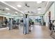 Bright and airy gym with weights, treadmills, mirrored walls and lots of natural light at 4155 Cascade Falls Dr, Sarasota, FL 34243