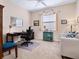 Comfortable home office space with ample desk space and a relaxing seating area at 4155 Cascade Falls Dr, Sarasota, FL 34243