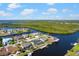 Aerial view of waterfront homes on canals surrounded by lush greenery at 4196 Eastlake Ct, Port Charlotte, FL 33948