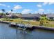 Waterfront home with a private pool and dock, offering direct access to the canal at 4196 Eastlake Ct, Port Charlotte, FL 33948