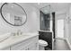 Modern bathroom featuring a walk in shower with gray tile and a glass partition at 4196 Eastlake Ct, Port Charlotte, FL 33948