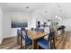 Open concept dining room with a view to the kitchen, and a large picture window at 4196 Eastlake Ct, Port Charlotte, FL 33948