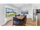 Dining room with picture window and view of the neighborhood at 4196 Eastlake Ct, Port Charlotte, FL 33948