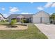 Charming home featuring a well-manicured lawn and a two-car garage at 4196 Eastlake Ct, Port Charlotte, FL 33948