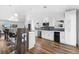 Bright white kitchen with stainless steel appliances, wine cooler and long breakfast bar at 4196 Eastlake Ct, Port Charlotte, FL 33948