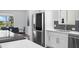 Bright kitchen with stainless steel appliances, white cabinets, and a view from the window at 4196 Eastlake Ct, Port Charlotte, FL 33948
