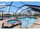 Private screened-in pool and jacuzzi offering a tranquil retreat at 4196 Eastlake Ct, Port Charlotte, FL 33948