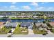 Street view of well-maintained homes along a canal with boat docks and beautiful landscaping at 4196 Eastlake Ct, Port Charlotte, FL 33948
