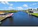 Wide canal with boat lift and dock access, adjacent to houses with private waterfront views at 4196 Eastlake Ct, Port Charlotte, FL 33948