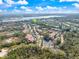 Panoramic aerial shot showcasing the condominium community nestled among trees, lakes, and lush landscaping at 5552 Bentgrass Dr # 7-116, Sarasota, FL 34235