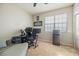 Bedroom with a large window and a mini-refrigerator at 5552 Bentgrass Dr # 7-116, Sarasota, FL 34235