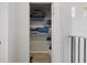 Closet space featuring white wire shelving, offering ample storage, and a view of the second floor at 5552 Bentgrass Dr # 7-116, Sarasota, FL 34235