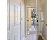 Inviting entryway with open door leading to the outside and tile flooring at 5552 Bentgrass Dr # 7-116, Sarasota, FL 34235