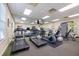 Well-equipped gym featuring treadmills, elliptical machines, weight machines, and a mirrored wall at 5552 Bentgrass Dr # 7-116, Sarasota, FL 34235