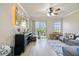 Cozy living room with a large sliding door, comfortable seating and modern decor at 5552 Bentgrass Dr # 7-116, Sarasota, FL 34235