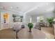 Inviting lounge area with TV, comfortable seating, and view of the community at 5552 Bentgrass Dr # 7-116, Sarasota, FL 34235