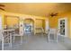 The outdoor kitchen with sink, ceiling fan, and several seating options at 5552 Bentgrass Dr # 7-116, Sarasota, FL 34235