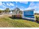 Nathan Benderson Park sign showing the park name and address with beautiful landscaping on a sunny day at 5552 Bentgrass Dr # 7-116, Sarasota, FL 34235