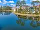 Lakefront condo with private balcony overlooking scenic waterway and lush greenery at 5552 Bentgrass Dr # 7-116, Sarasota, FL 34235