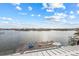 Beautiful aerial view of a waterfront home featuring a dock, pool, and stunning views at 624 N Point Dr, Holmes Beach, FL 34217