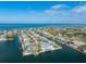 Stunning aerial view of waterfront homes with private docks and access to the ocean in a coastal community at 624 N Point Dr, Holmes Beach, FL 34217